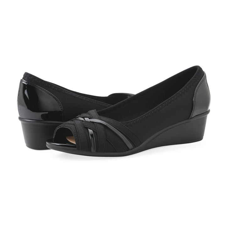 Angel view of a pair of slip on wedge with a peep toe in navy blue