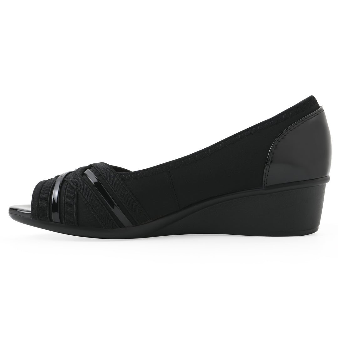 Side view of slip on wedge with a peep toe in navy blue