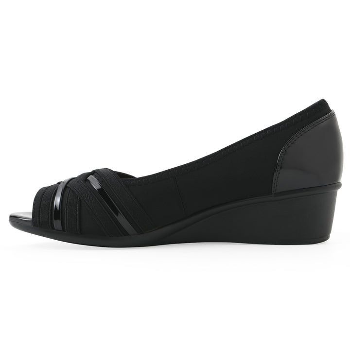 Side view of slip on wedge with a peep toe in navy blue