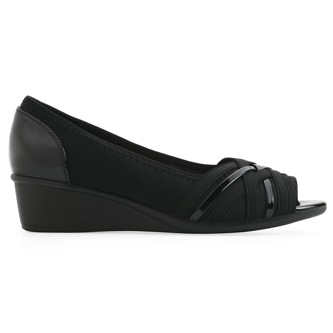Side view of slip on wedge with a peep toe in navy blue