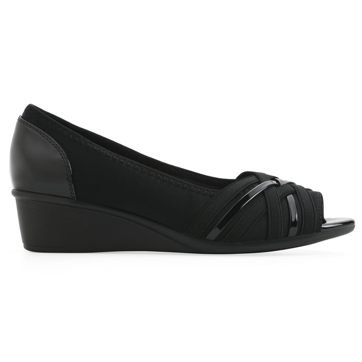 Side view of slip on wedge with a peep toe in navy blue