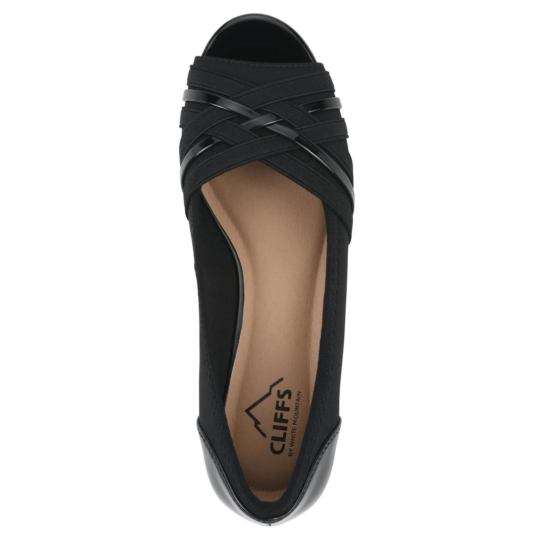 Top view of slip on wedge with a peep toe in navy blue