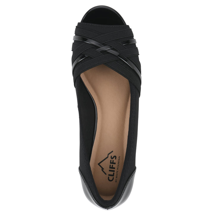 Top view of slip on wedge with a peep toe in navy blue