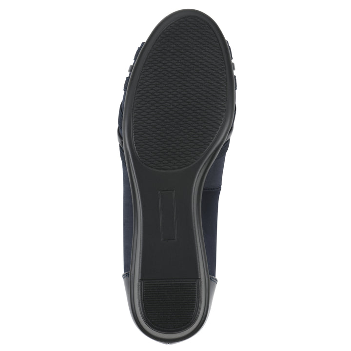 Sole view of slip on wedge with a peep toe in navy blue