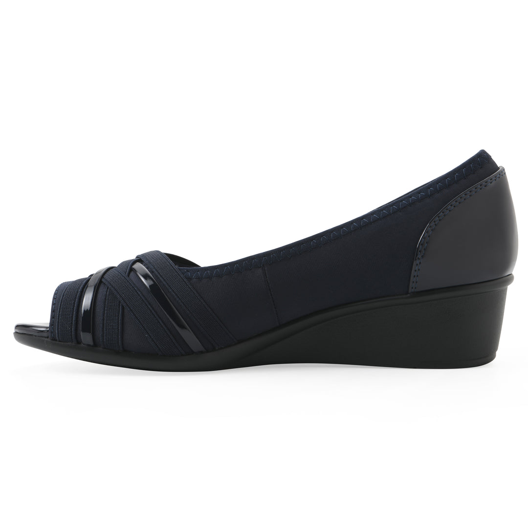Side 
view of slip on wedge with a peep toe in navy blue