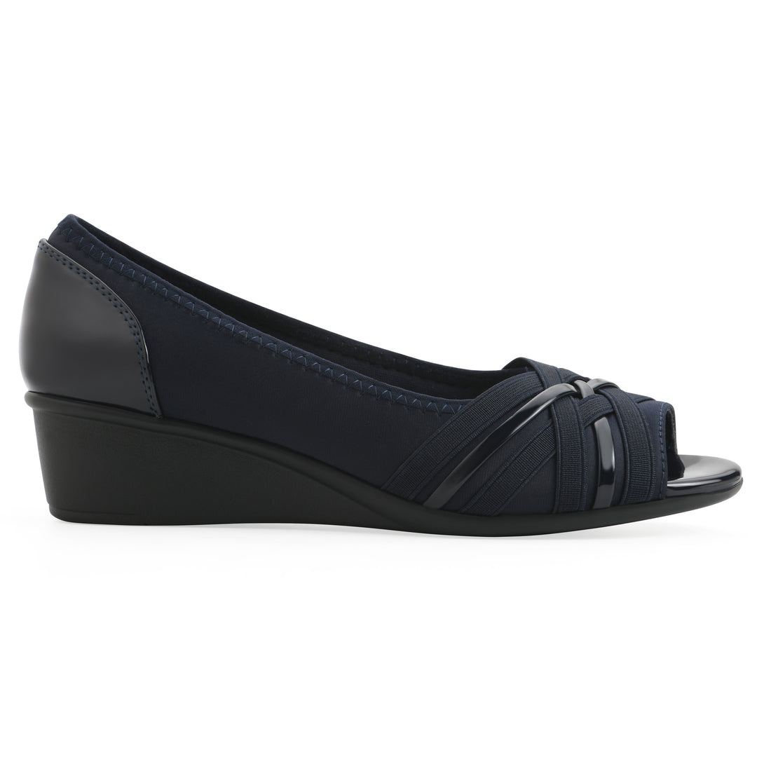 Side view of slip on wedge with a peep toe in navy blue