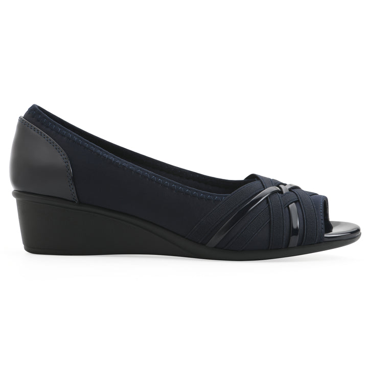 Side view of slip on wedge with a peep toe in navy blue