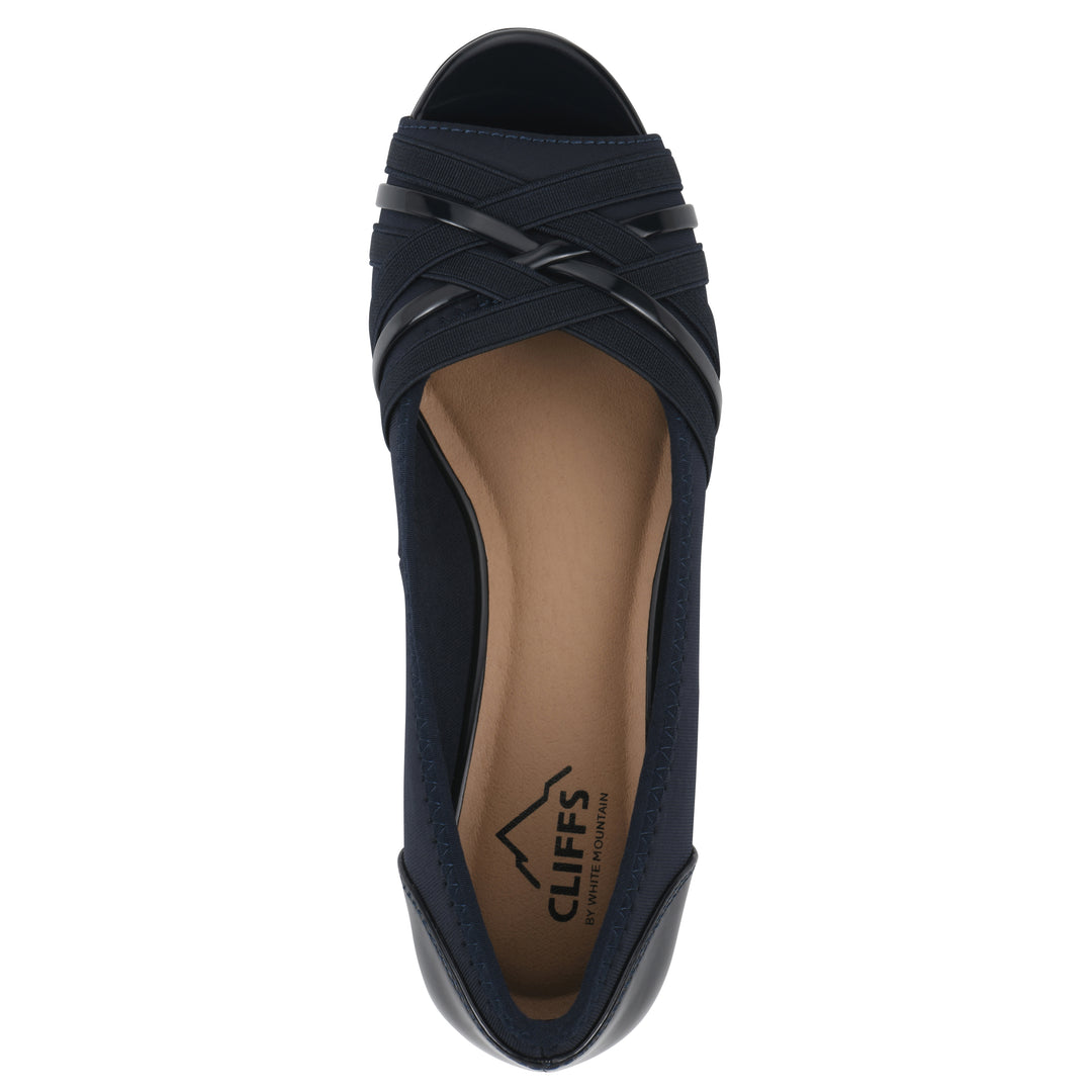Top view of slip on wedge with a peep toe in navy blue