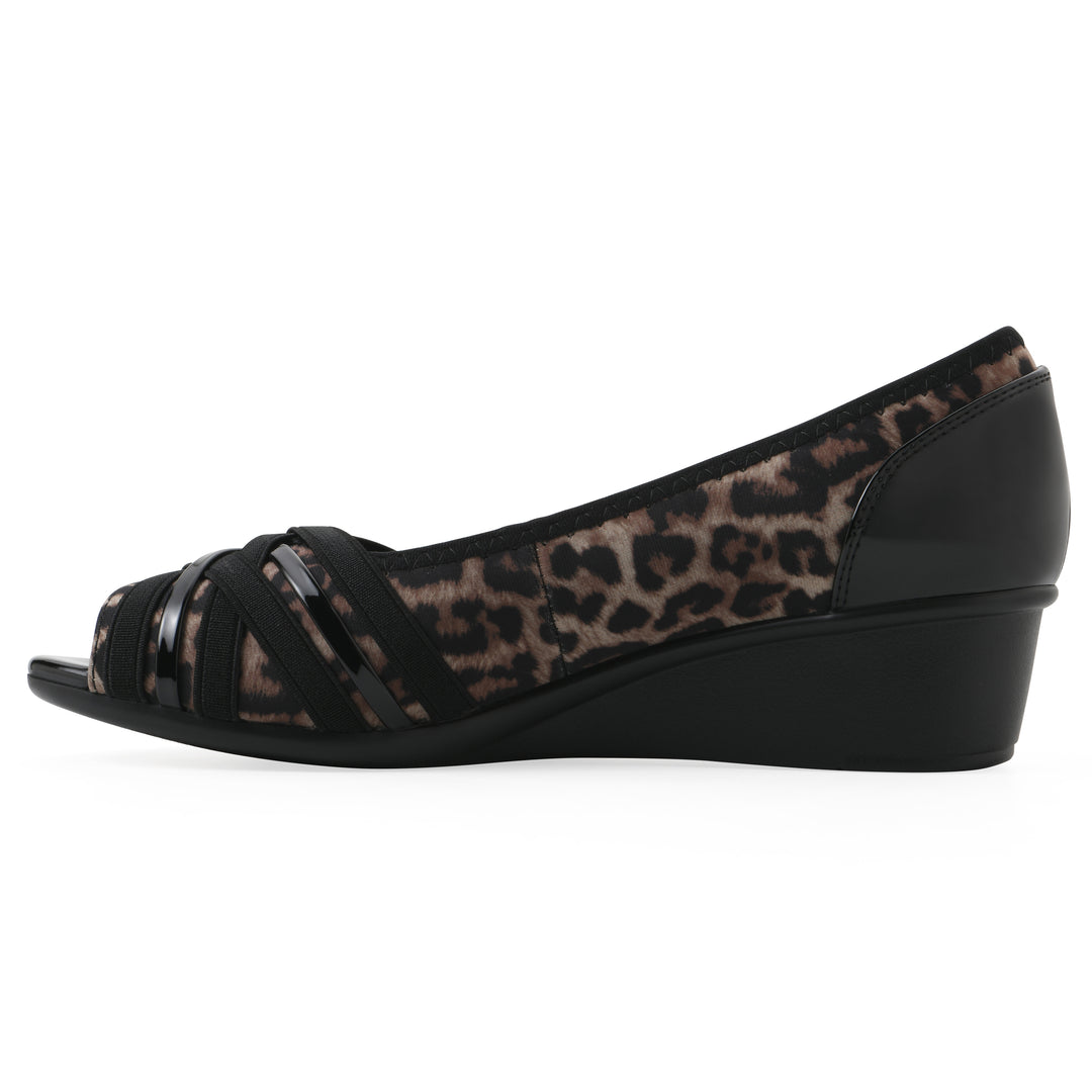 Side view of slip on wedge with a peep toe in leopard print 