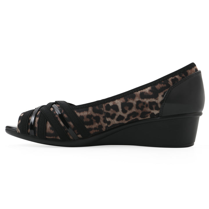 Side view of slip on wedge with a peep toe in leopard print 