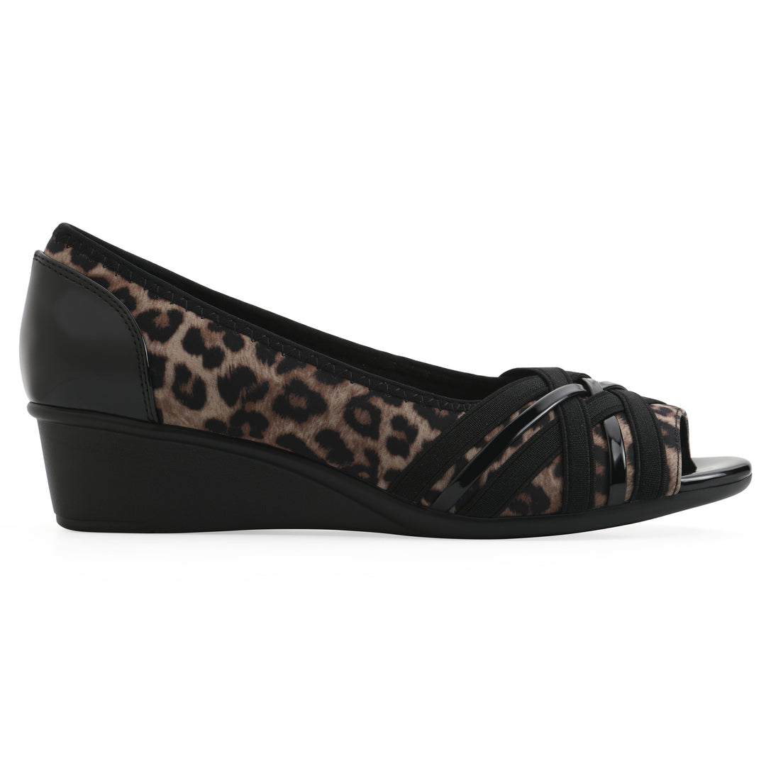 Side view of slip on wedge with a peep toe in leopard print 