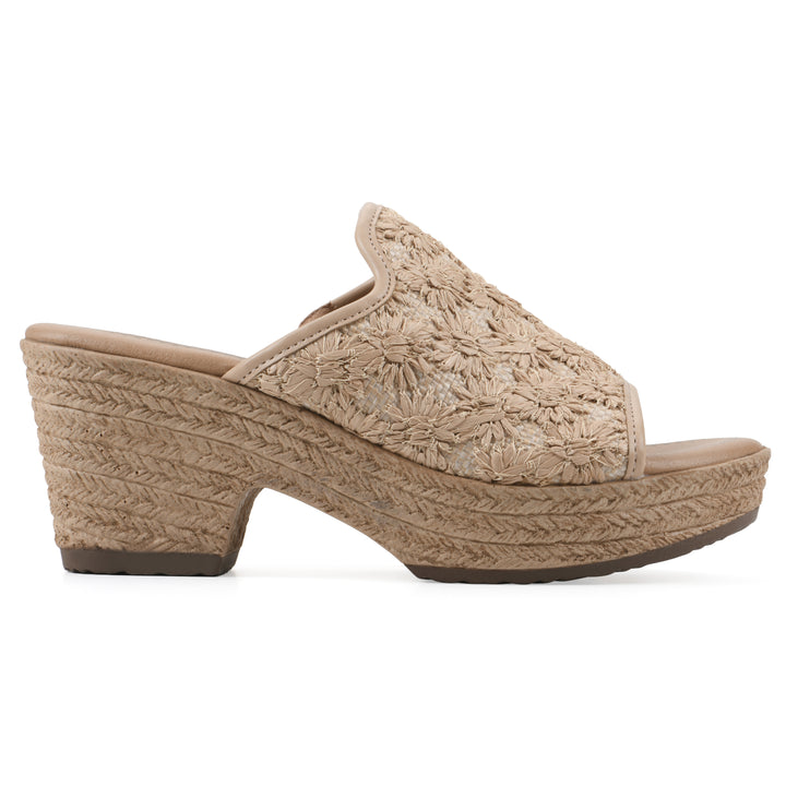 Side view of a natural beige embroidered fabric wedge sandal with a braided rope-style sole