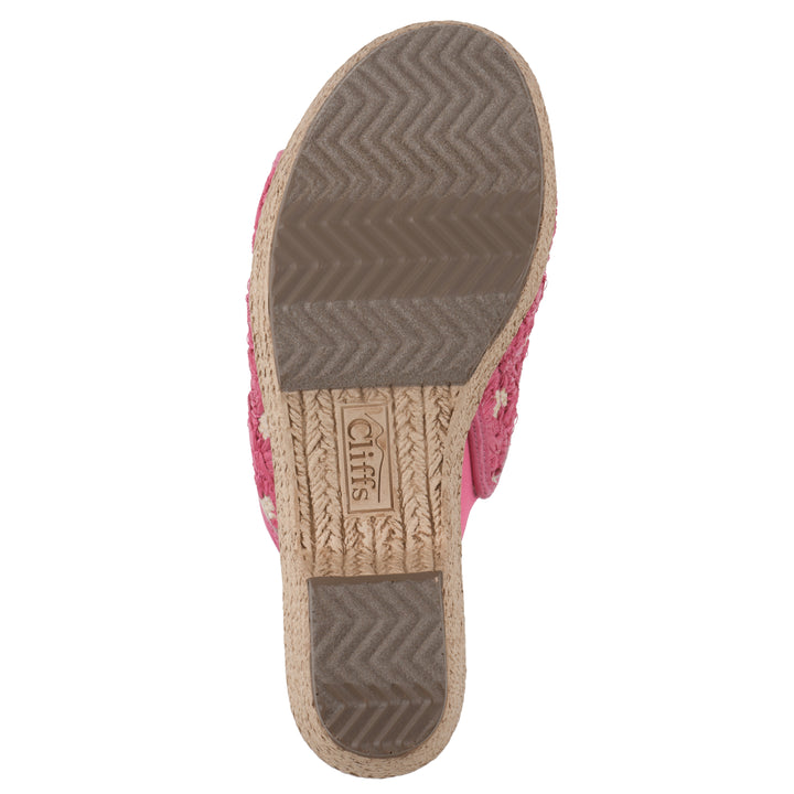 Sole view of a magenta embroidered fabric wedge sandal with a braided rope-style sole