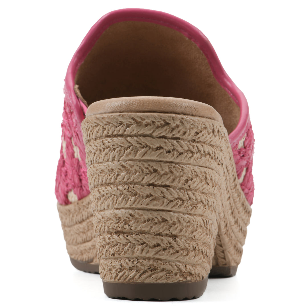 Rear view of a magenta embroidered fabric wedge sandal with a braided rope-style sole