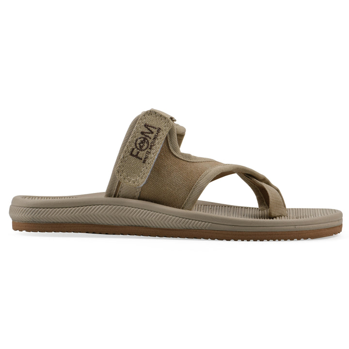 Side view of a khaki fabric thong sandal with velcro center strap and a tan sole