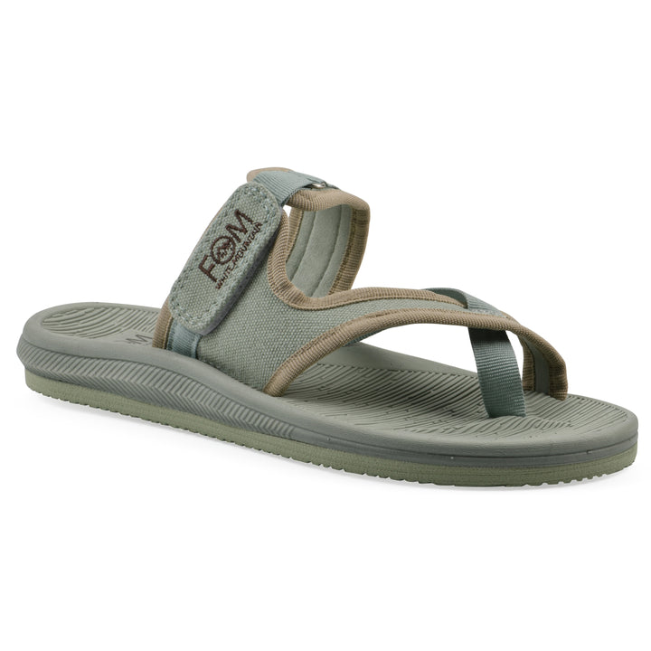 Angle view of a sage fabric thong sandal with velcro center strap and a sage sole