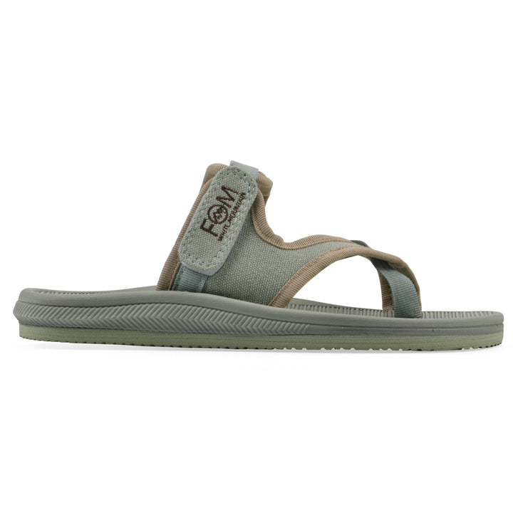 Side view of a sage fabric thong sandal with velcro center strap and a sage sole