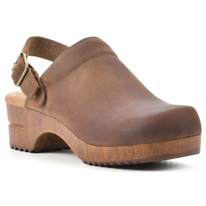 Angle view of a backless brown leather clog with adjustable back strap and wood style heel