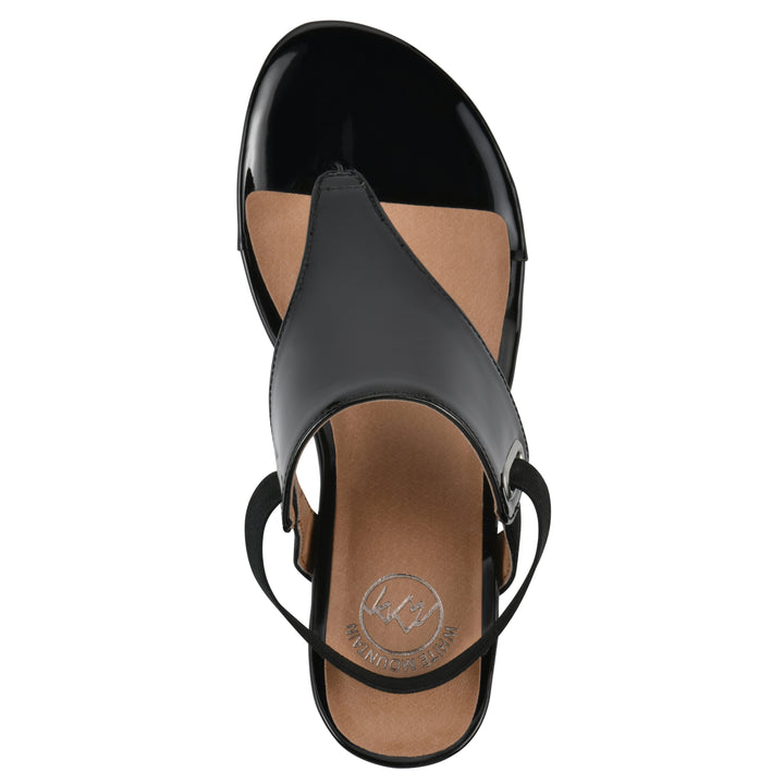 Top view of a black patent thong wedge sandal with a wrapped heel, elastic ankle strap, and black sole