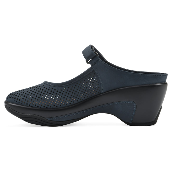 Side view of a navy-colored clog with a closed toe and adjustable strap, featuring a perforated diamond design and a low heel.
