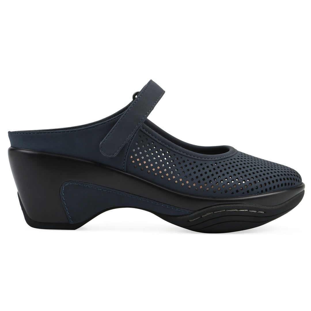 Side view of a navy-colored clog with a closed toe and adjustable strap, featuring a perforated diamond design and a low heel.