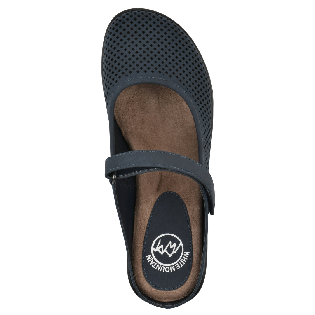 Top view of a navy-colored clog with a closed toe and adjustable strap, featuring a perforated diamond design and a low heel.