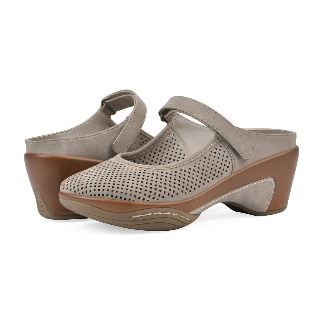 Angel view of a pair of light taupe-colored clog with a closed toe and adjustable strap, featuring a perforated diamond design and a low heel.