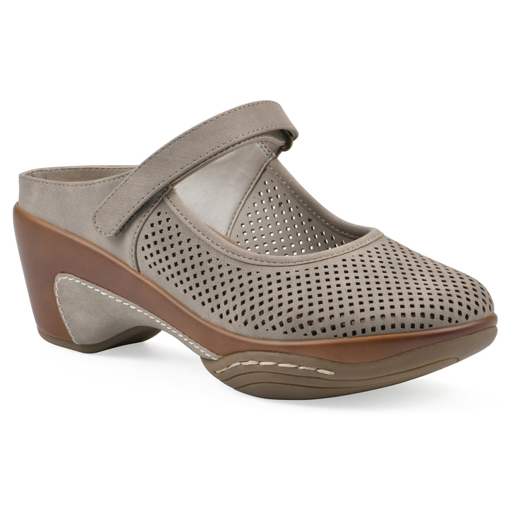 Angel view of a light taupe-colored clog with a closed toe and adjustable strap, featuring a perforated diamond design and a low heel.