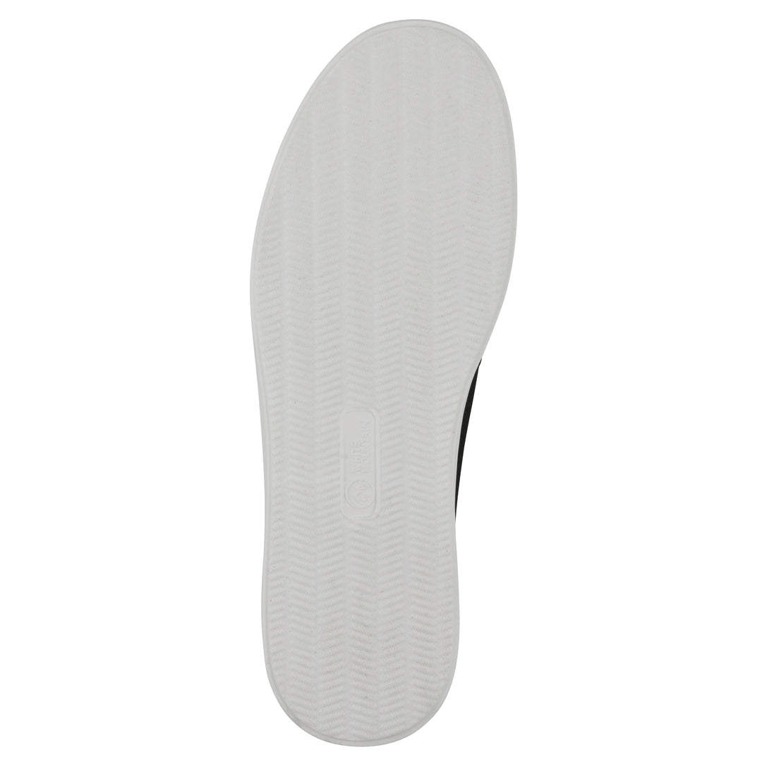 Sole view of a black slip-on sneaker with white sole, and perforated mesh fabric