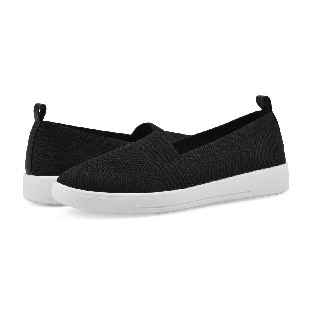 Angle view of a pair of black slip-on sneaker with white sole, and perforated mesh fabric
