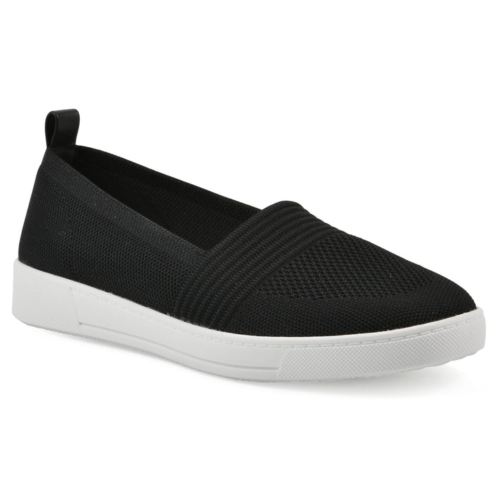 Angle view of a black slip-on sneaker with white sole, and perforated mesh fabric