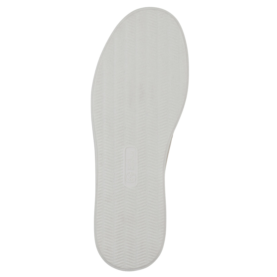 Sole view of a taupe slip-on sneaker with white sole, and perforated mesh fabric