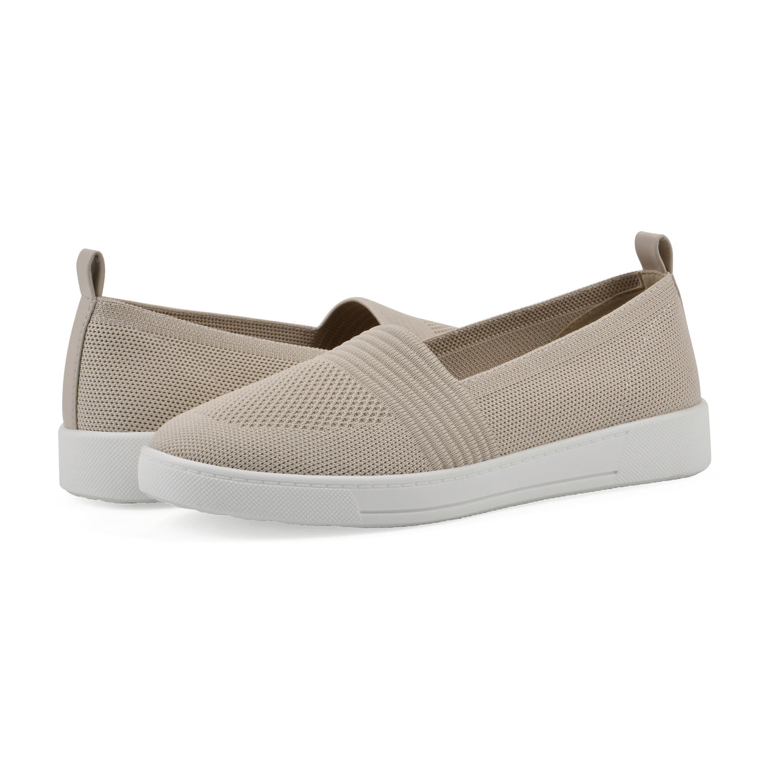Angle view of a pair of taupe slip-on sneaker with white sole, and perforated mesh fabric