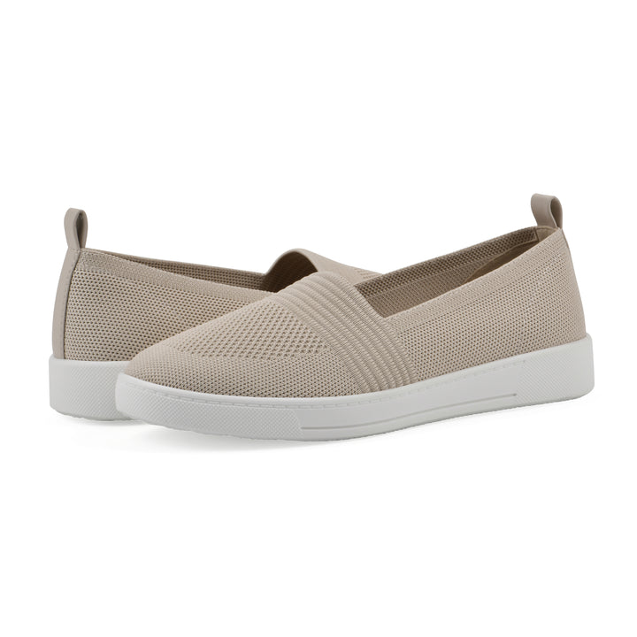 Angle view of a pair of taupe slip-on sneaker with white sole, and perforated mesh fabric