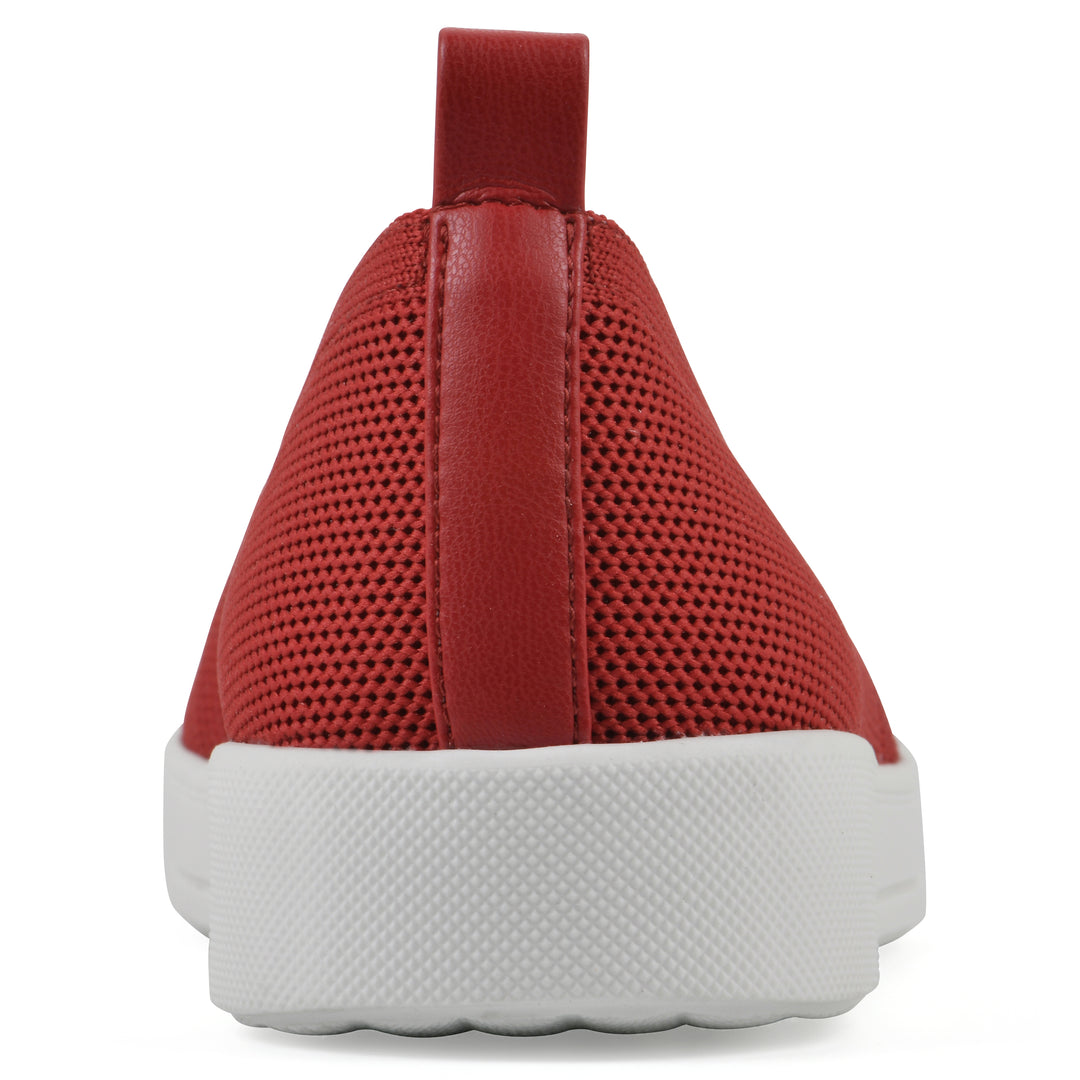 Heel view of a red slip-on sneaker with white sole, and perforated mesh fabric