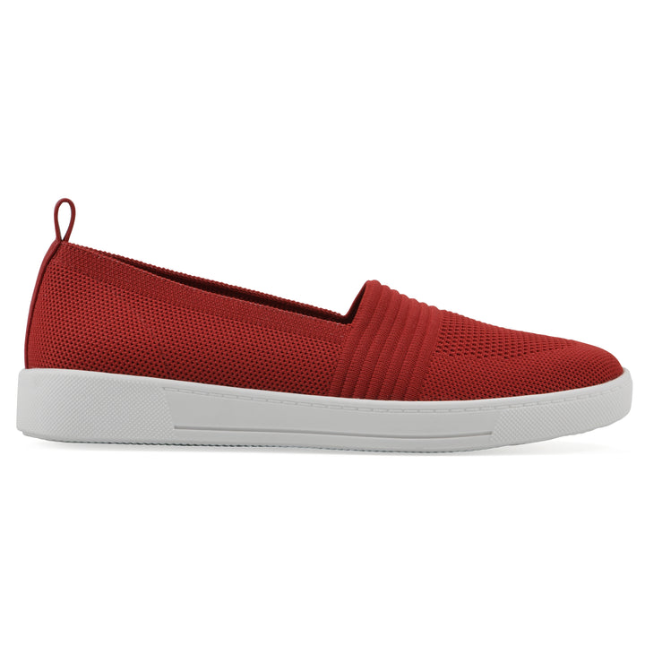 Side view of a red slip-on sneaker with white sole, and perforated mesh fabric