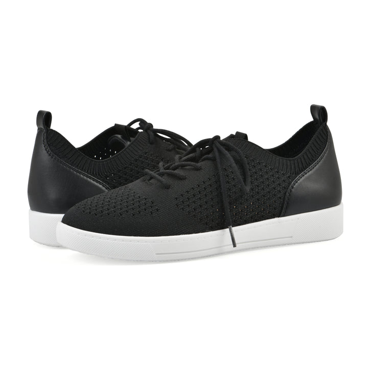 Side view of a pair of black sneaker with white sole, lace-up design and perforated mesh fabric