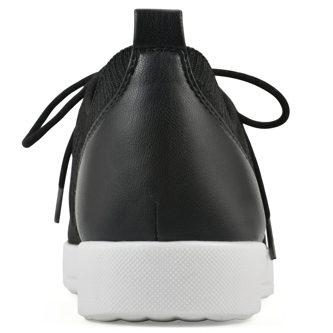 Rear view of a black sneaker with white sole, lace-up design and perforated mesh fabric