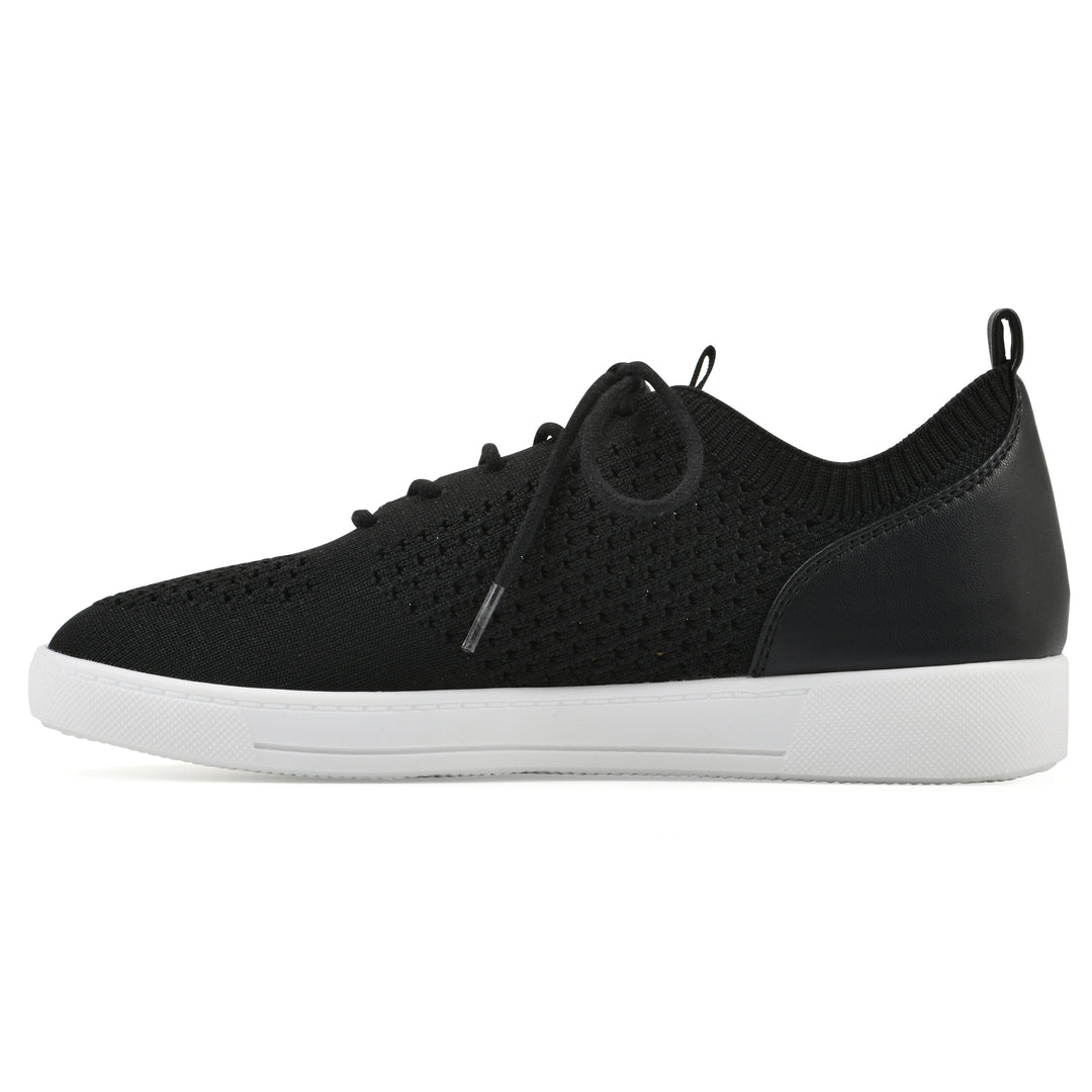Side view of a black sneaker with white sole, lace-up design and perforated mesh fabric
