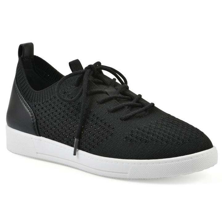 Angle view of a black sneaker with white sole, lace-up design and perforated mesh fabric
