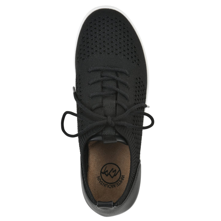 Top view of a black sneaker with white sole, lace-up design and perforated mesh fabric