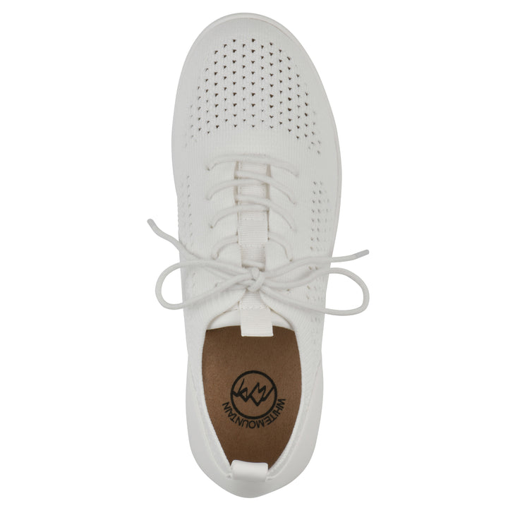 Top view of a white sneaker with lace-up design and perforated mesh fabric