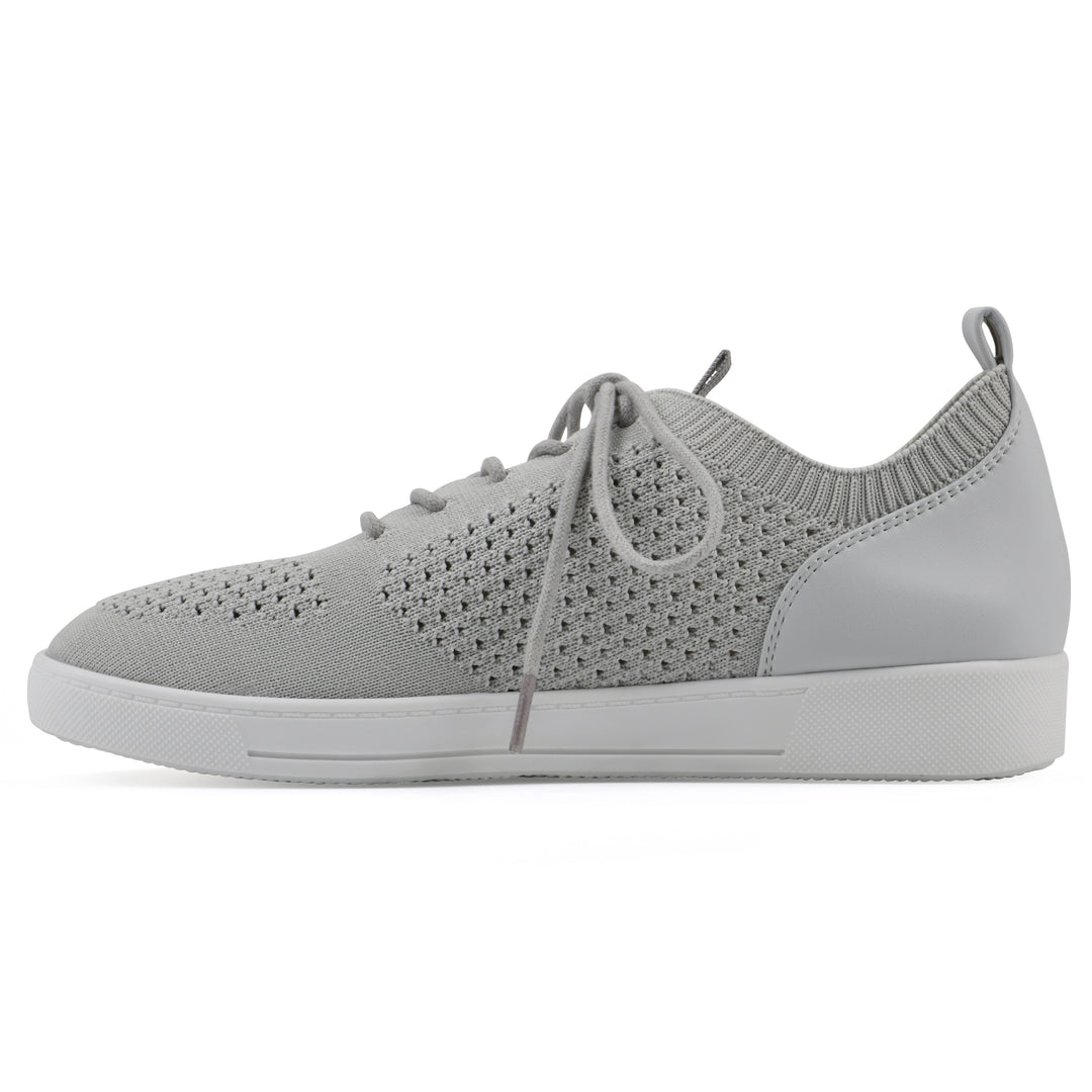Side view of a gray sneaker with white sole, lace-up design and perforated mesh fabric