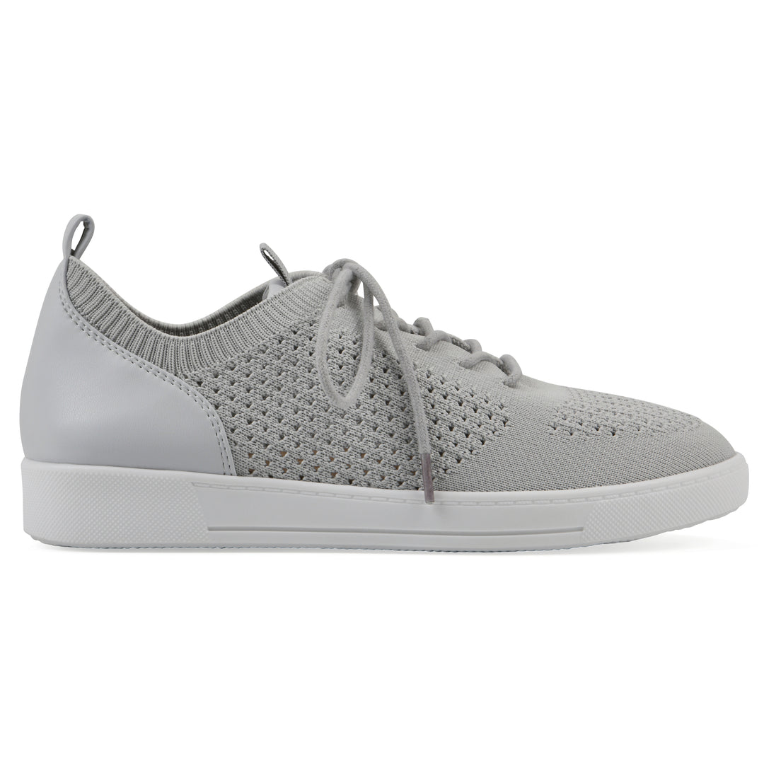 Side view of a gray sneaker with white sole, lace-up design and perforated mesh fabric