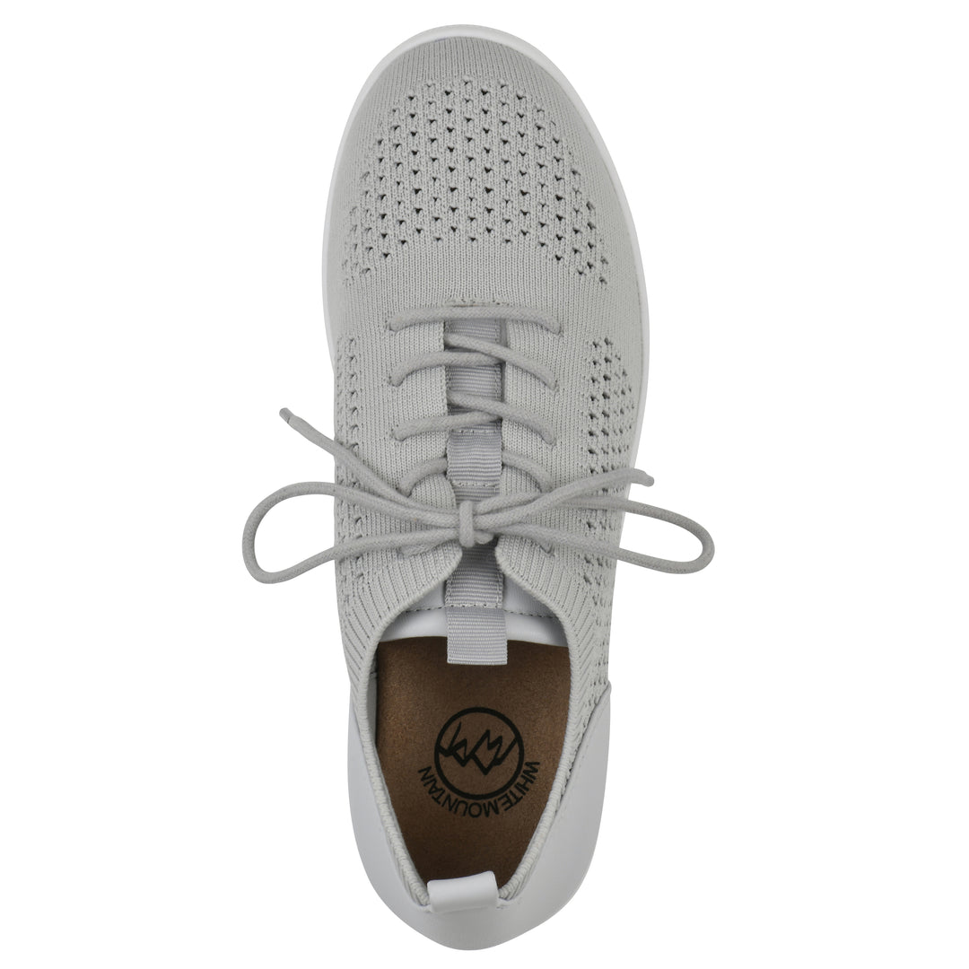 Top view of a gray sneaker with white sole, lace-up design and perforated mesh fabric