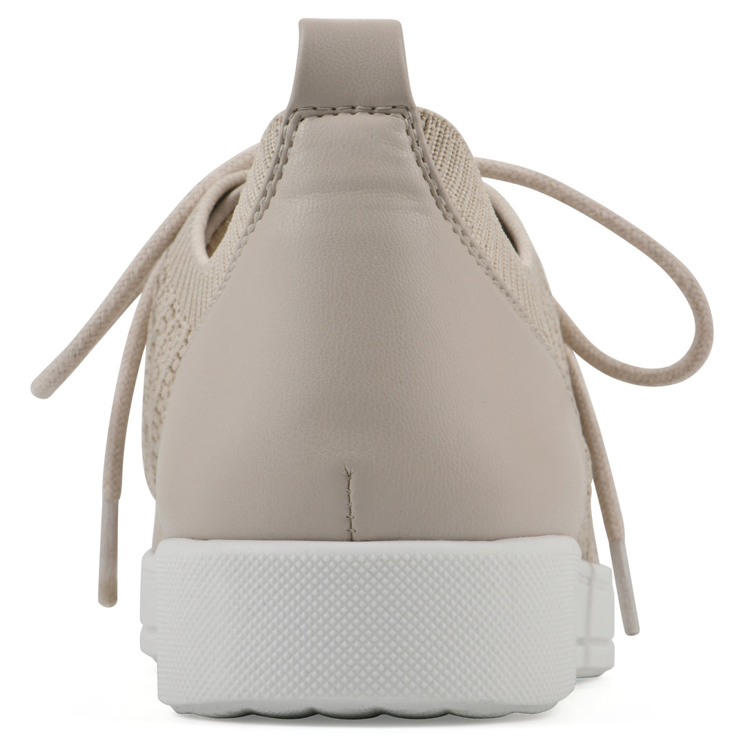 Heel view of a taupe sneaker with lace-up design and perforated mesh fabric