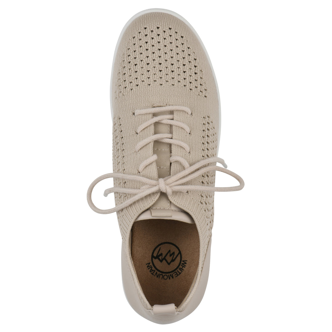 Top view of a taupe sneaker with lace-up design and perforated mesh fabric