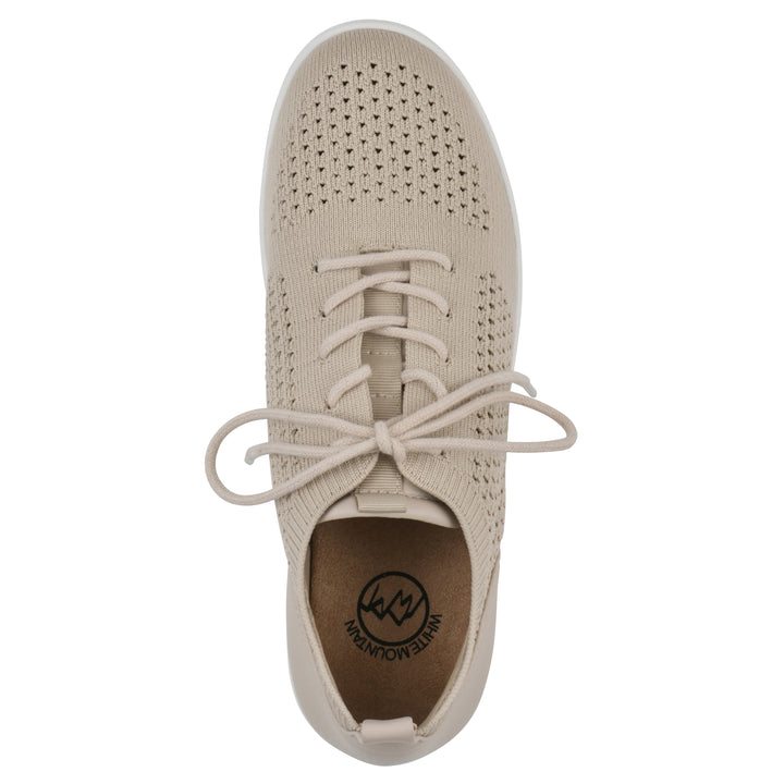 Top view of a taupe sneaker with lace-up design and perforated mesh fabric