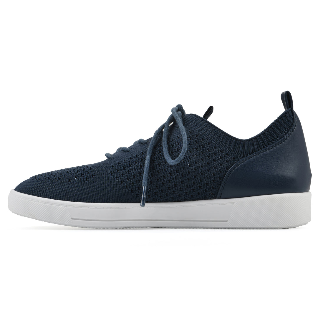 Side view of a navy sneaker with lace-up design and perforated mesh fabric
