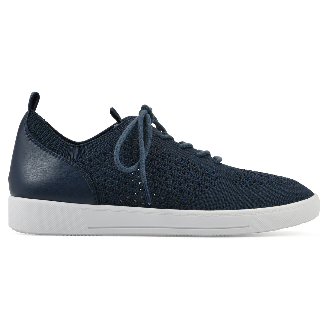 Side view of a navy sneaker with lace-up design and perforated mesh fabric